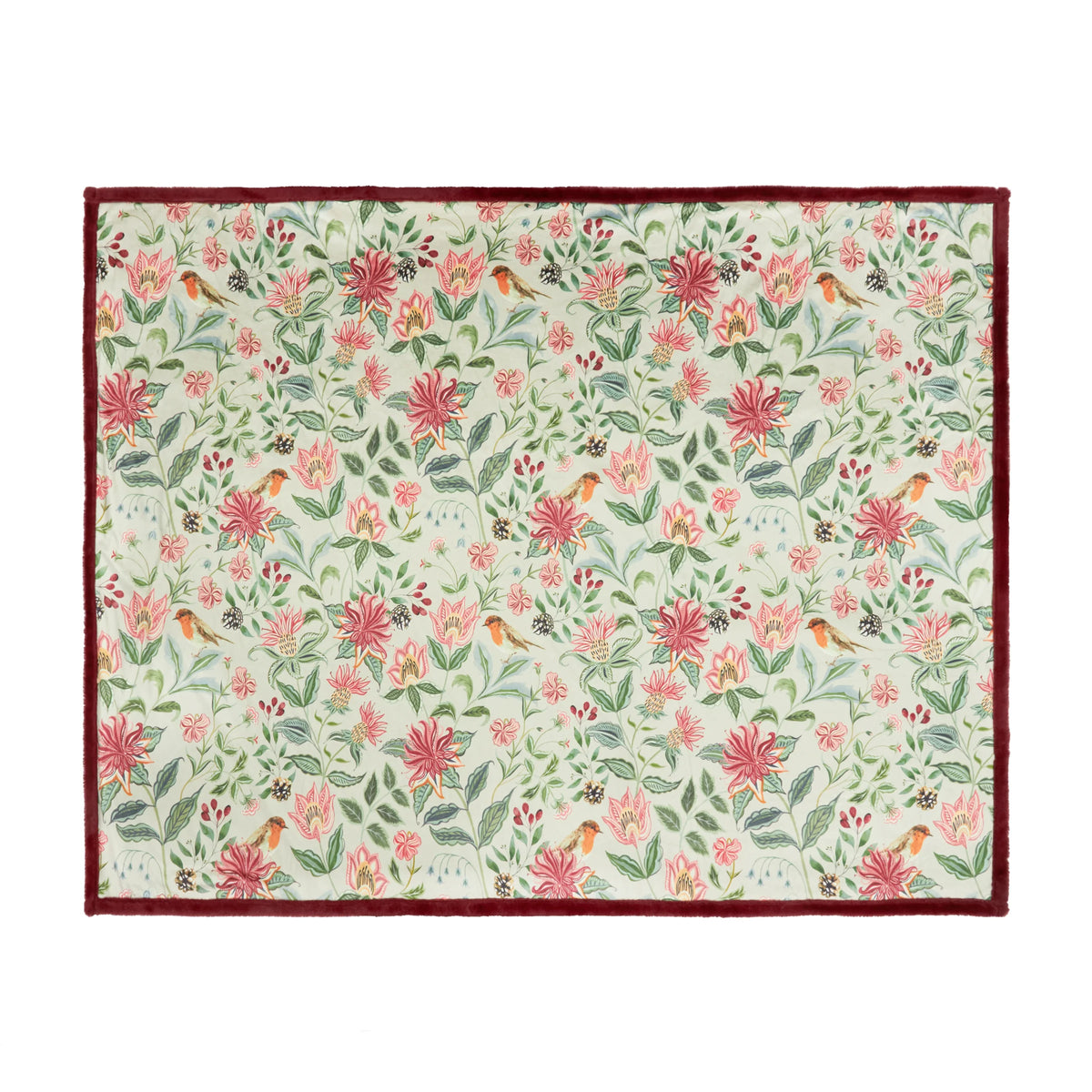 Flat top-down view of the full floral velvet throw showing an all-over repeat pattern of pink and red honeysuckle flowers, green leaves, pinecones and robins on a cream ground with a burgundy faux fur border – Kumperi