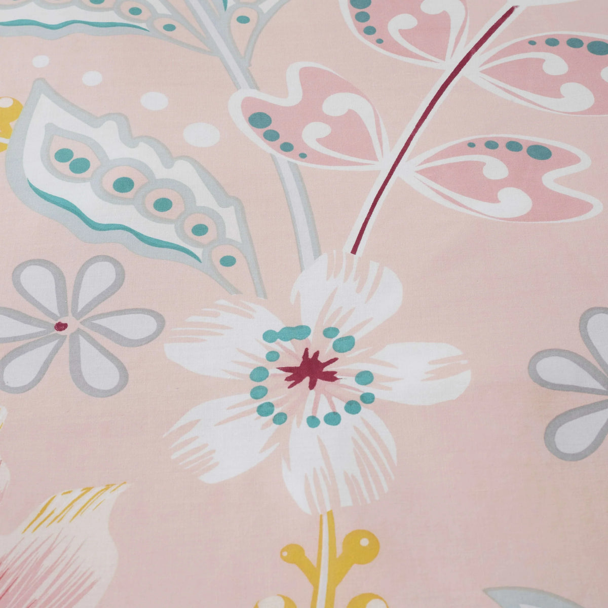 Close up of blush pink paisley floral cotton blend fabric