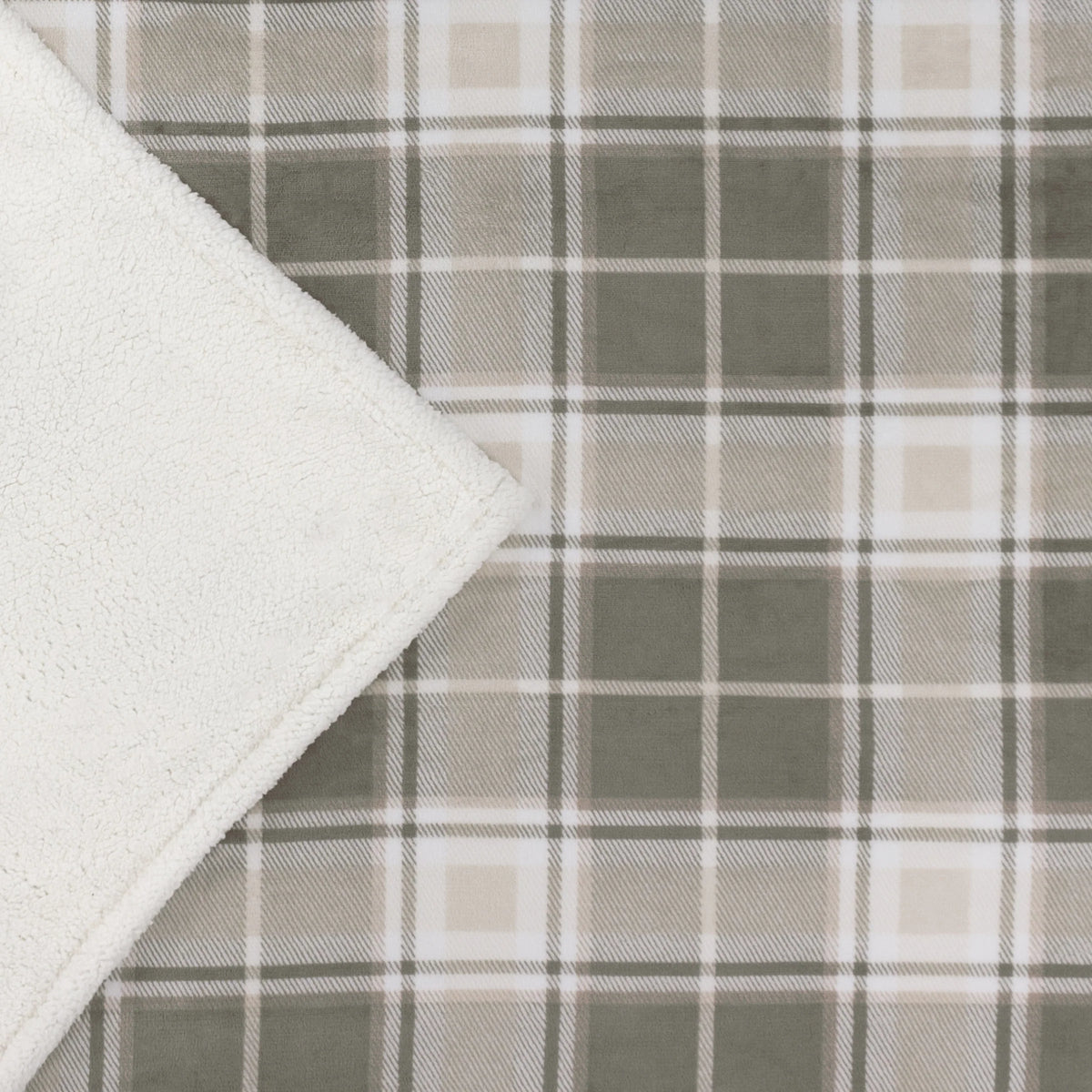 Corner of the throw folded back to show the green and taupe tartan check print face alongside the plain white sherpa fleece reverse – Kumperi