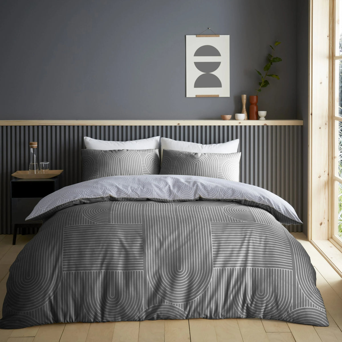 Charcoal grey reversible geometric king duvet cover set styled on a king bed bold modern bedroom aesthetic