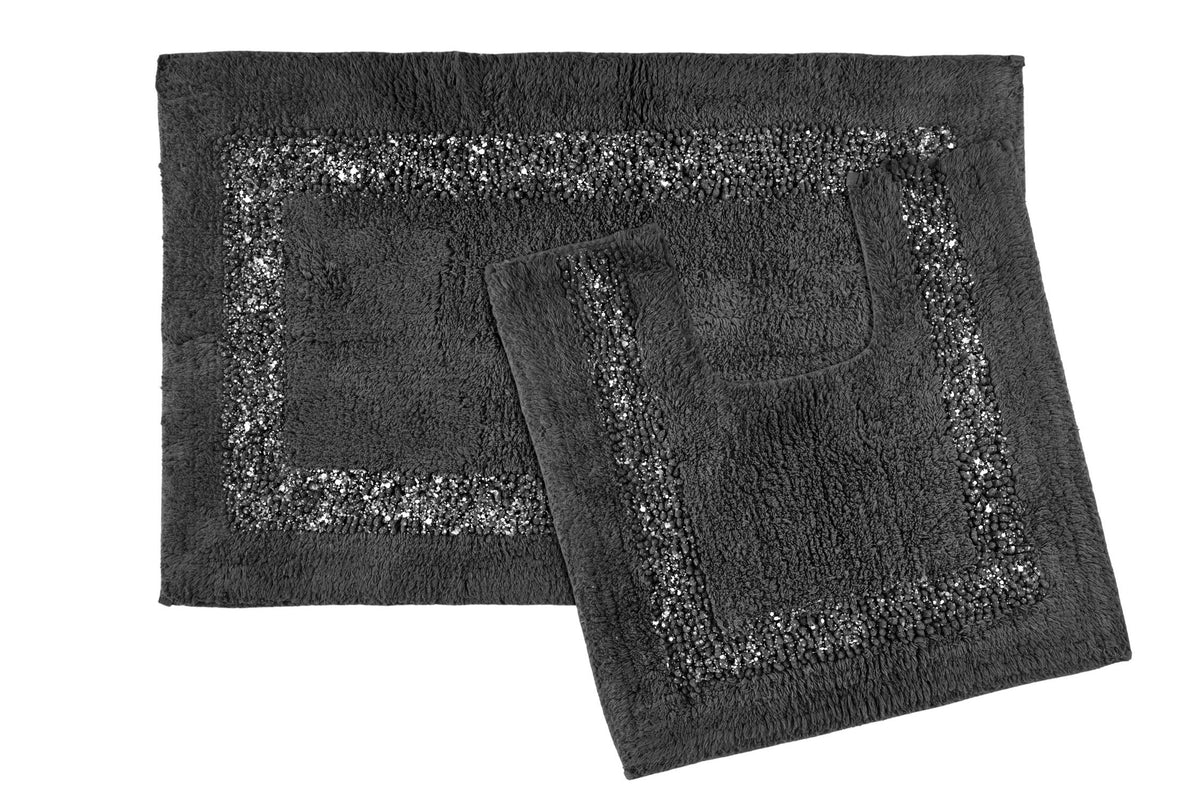 Charcoal Brillare cotton bath mat and pedestal mat overlapping on a white background showing mixed loop and bobble pile with subtle silver sparkle border trim 2-piece bathroom set Emma Barclay Panache Home