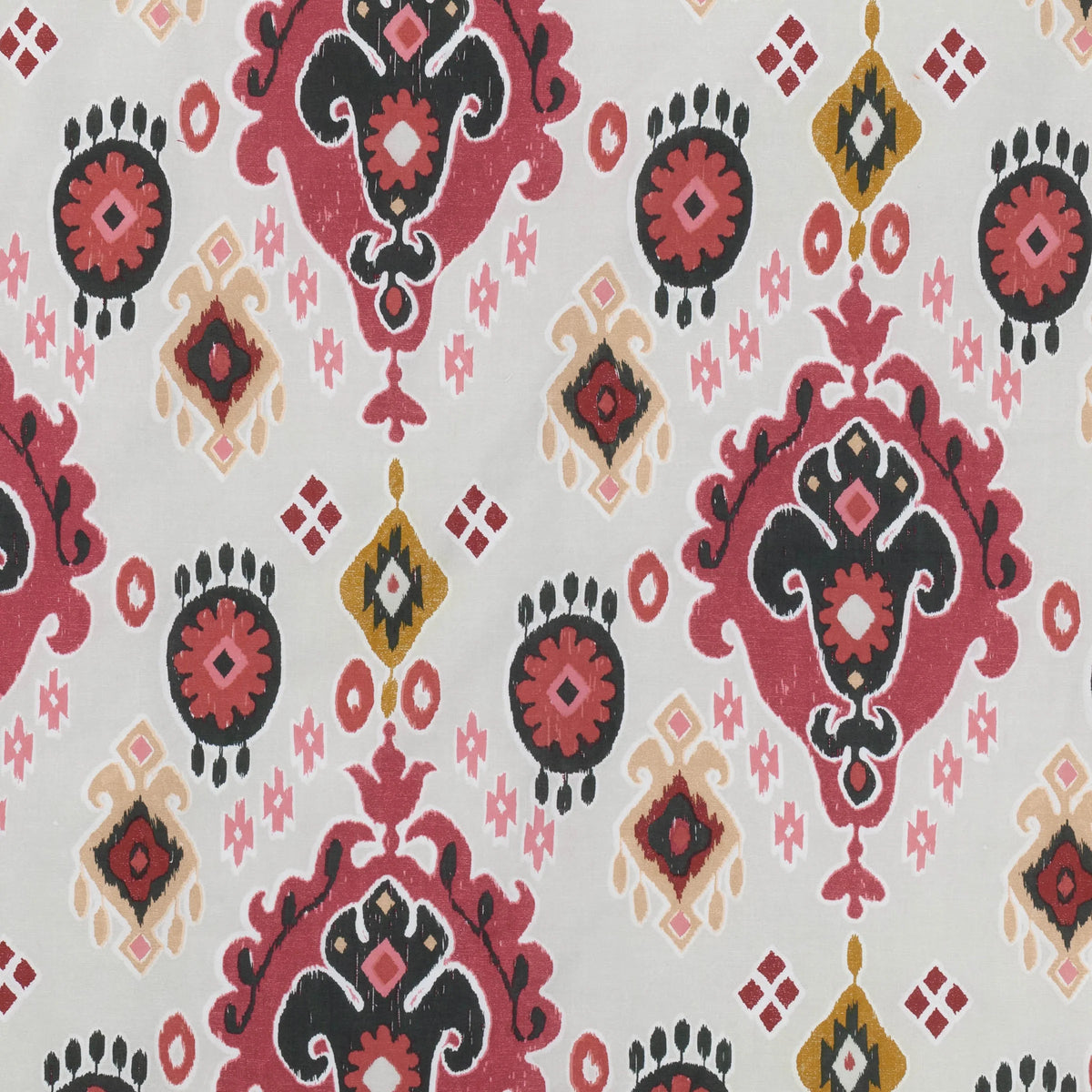 Close-up flat detail of the reverse white side of the Ikat print showing the same pink, black and mustard medallion and diamond motifs on a crisp white ground – Kumperi