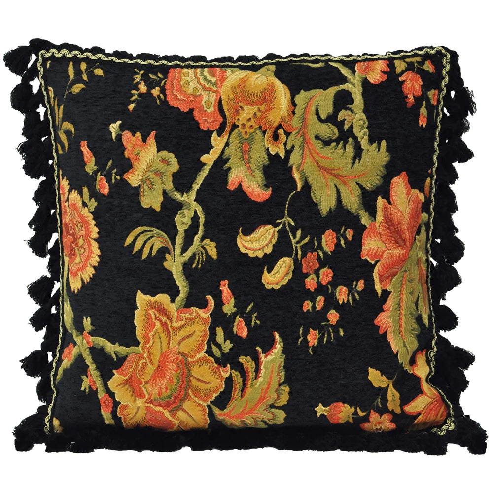 Square black chenille cushion woven with large orange and gold jacobean florals, olive green acanthus leaves and curling stems, edged with a gold and black cord and a full black tasselled fringe trim on all sides – Kumperi