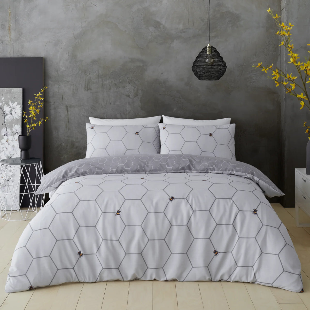 Grey bee geometric king duvet cover set styled on a king bed, contemporary nature inspired bedroom