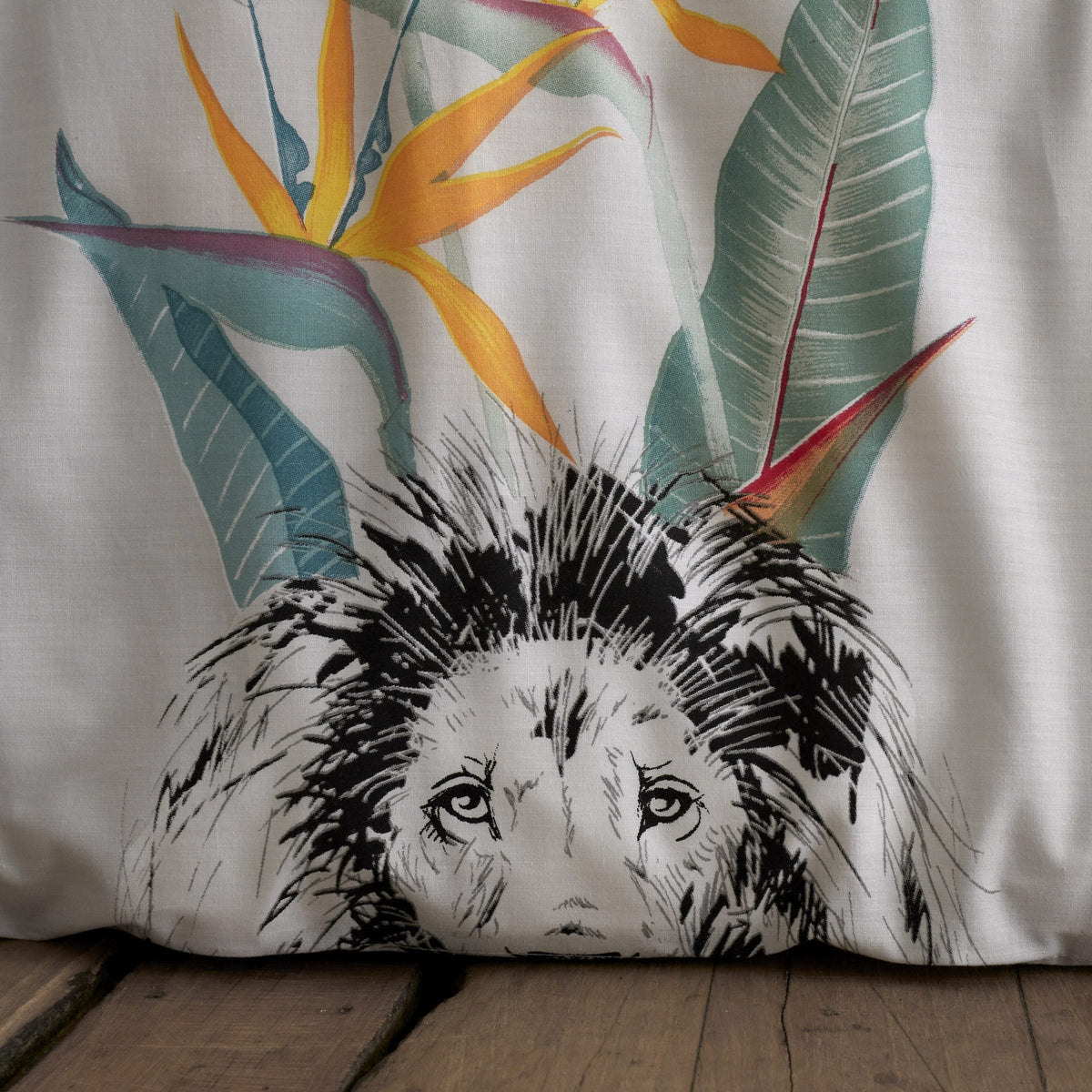 Close up detail of sketch-style safari animals and tropical botanicals on grey king duvet cover set
