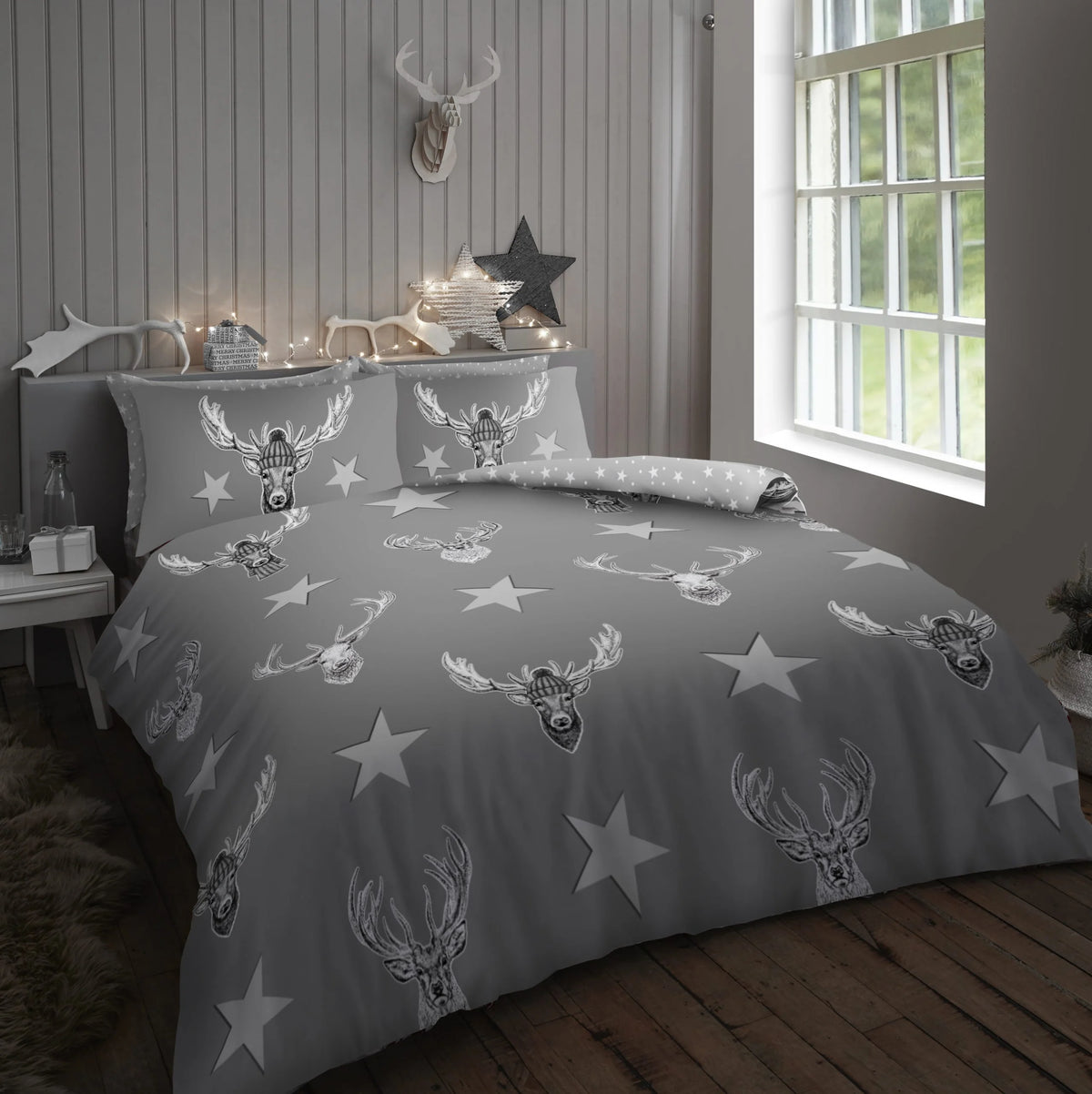 Grey king duvet cover set with all-over illustrated stag head antlers and white star print 50% cotton 50% polyester with 2 pillowcases