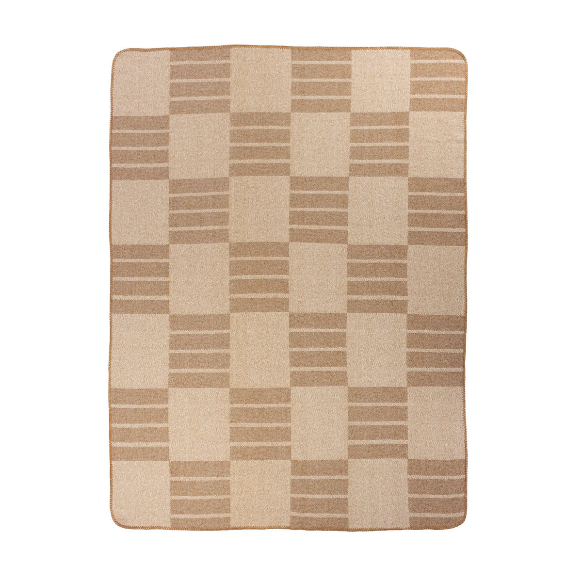 Flat top-down view of the full biscuit throw showing the woven geometric block and stripe repeat pattern in tan and cream across the entire fabric, with the tan blanket stitch trim around the border – Kumperi
