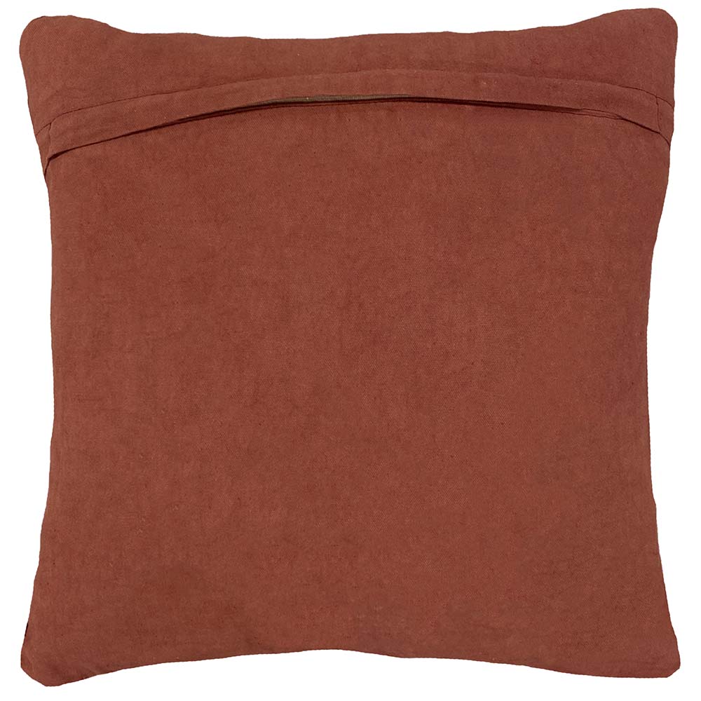 Plain terracotta red cotton reverse side of the cushion with a concealed zip closure along the top edge – Kumperi