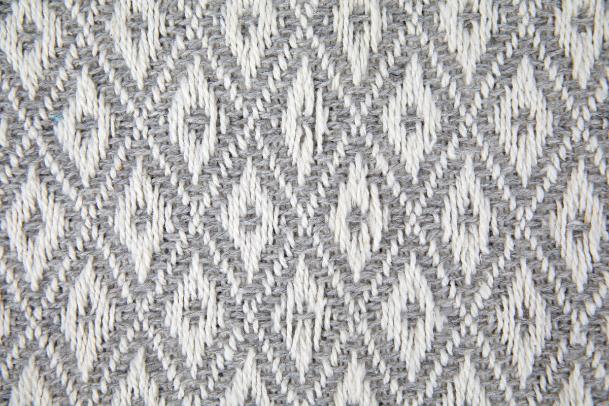 Close-up of silver-grey and white diamond weave fabric texture, Kumperi