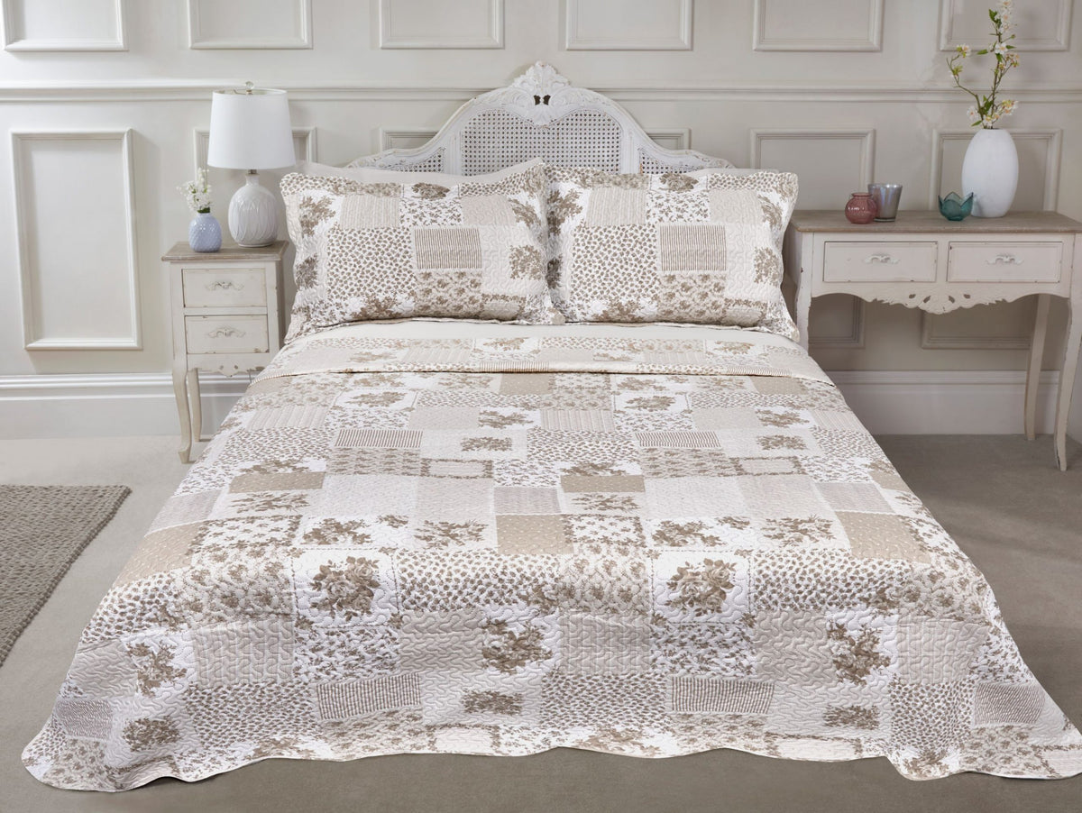 Natural quilted patchwork floral bedspread set styled on a neatly made double bed