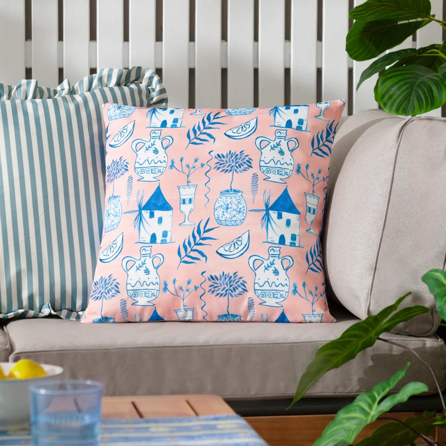 Peach art deco outdoor cushion styled on outdoor sofa with plants and lemons – furn.