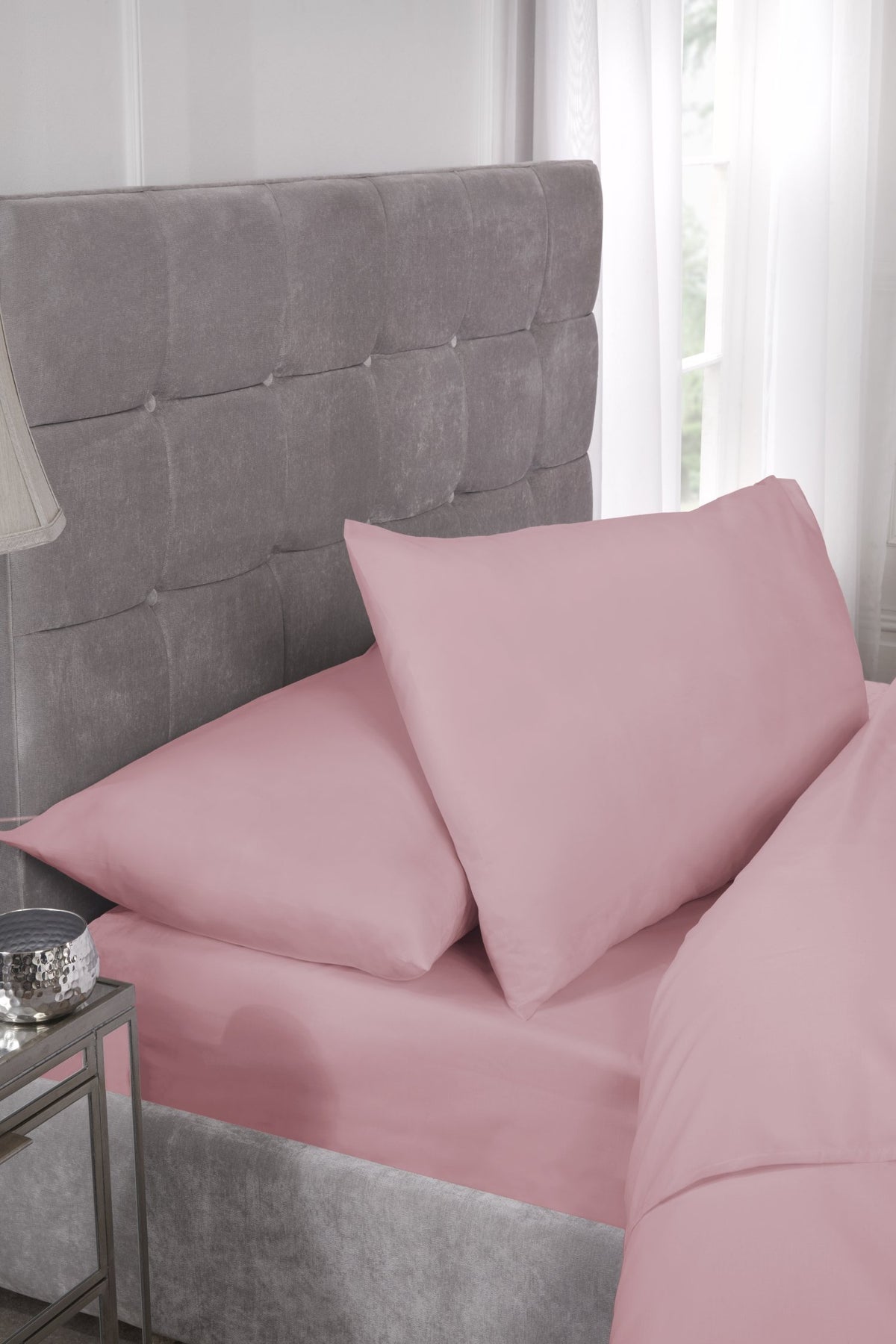 Close-up of smooth pink 180 thread count percale fabric texture, easy-iron finish