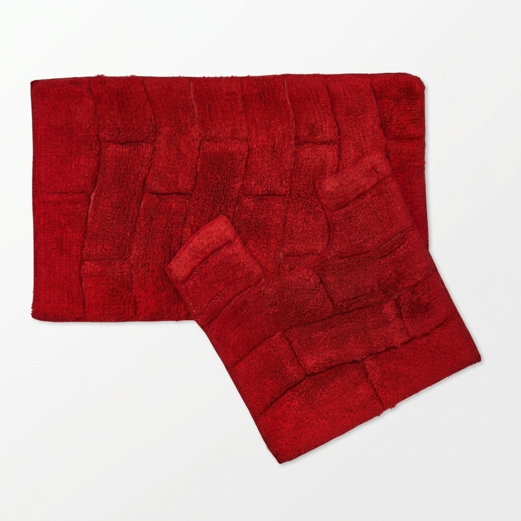 Red cotton wave texture bath mat and pedestal mat set angled overhead view showing raised block pile texture and deep red colour 2-piece set machine washable Emma Barclay Waves design