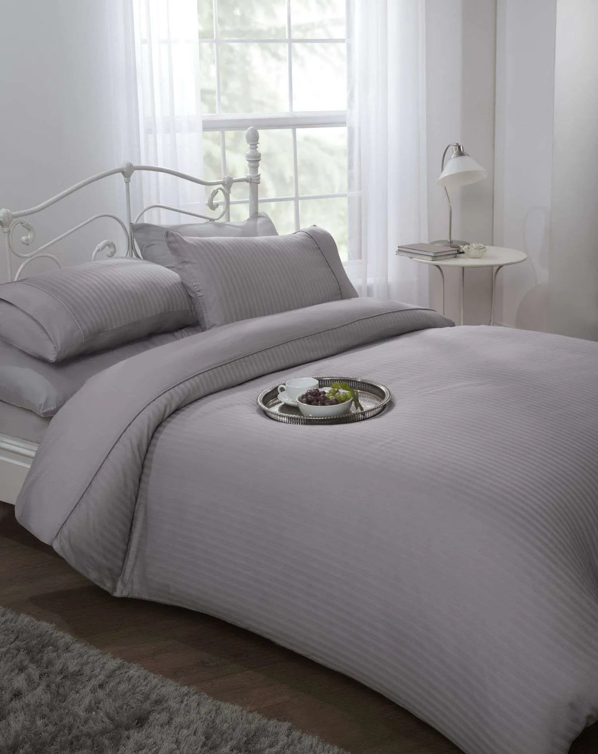 Silver 300 thread count sateen stripe king duvet cover set styled on a luxury hotel style bed