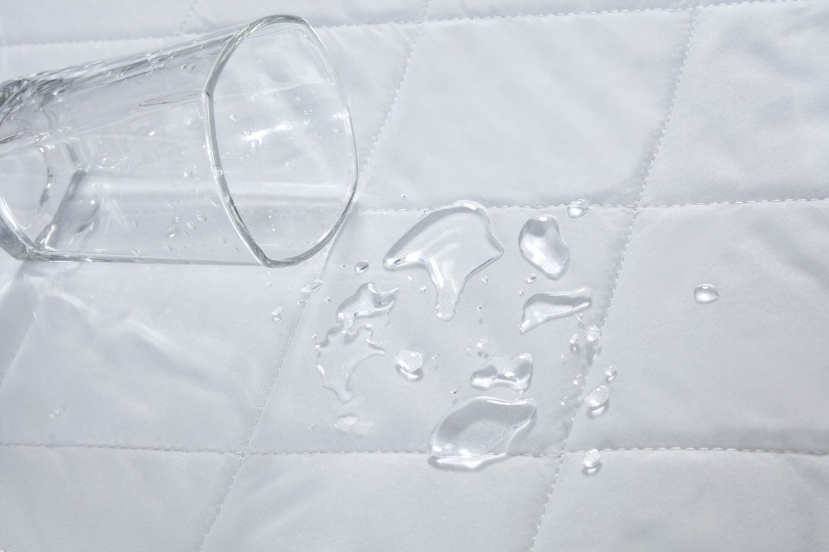 Close up of white supersoft quilted microfibre fabric on waterproof mattress protector