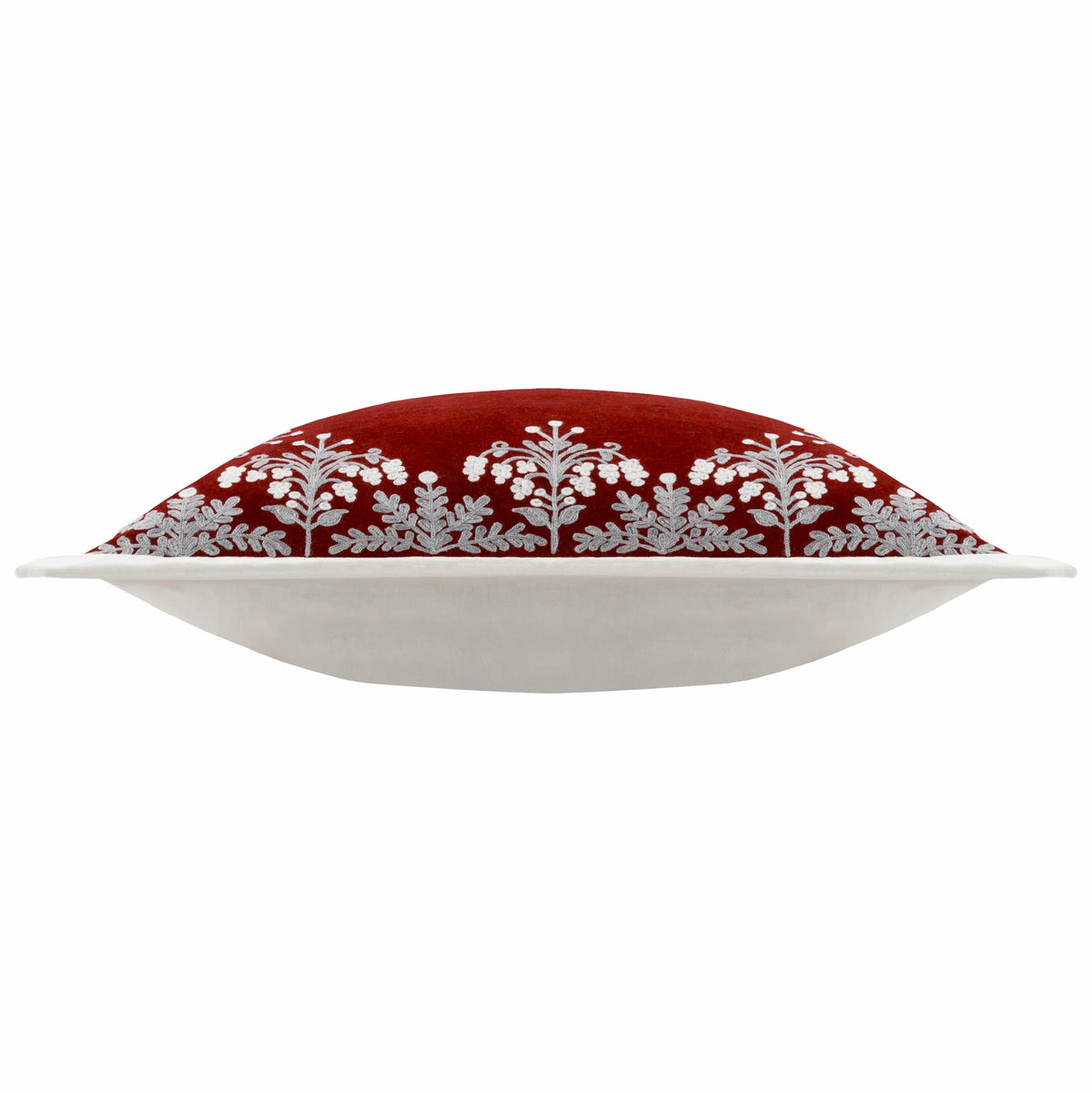 Side profile of the cushion showing the red velvet embroidered front with grey and white floral border meeting the plain white reverse along the Oxford border edge – Kumperi